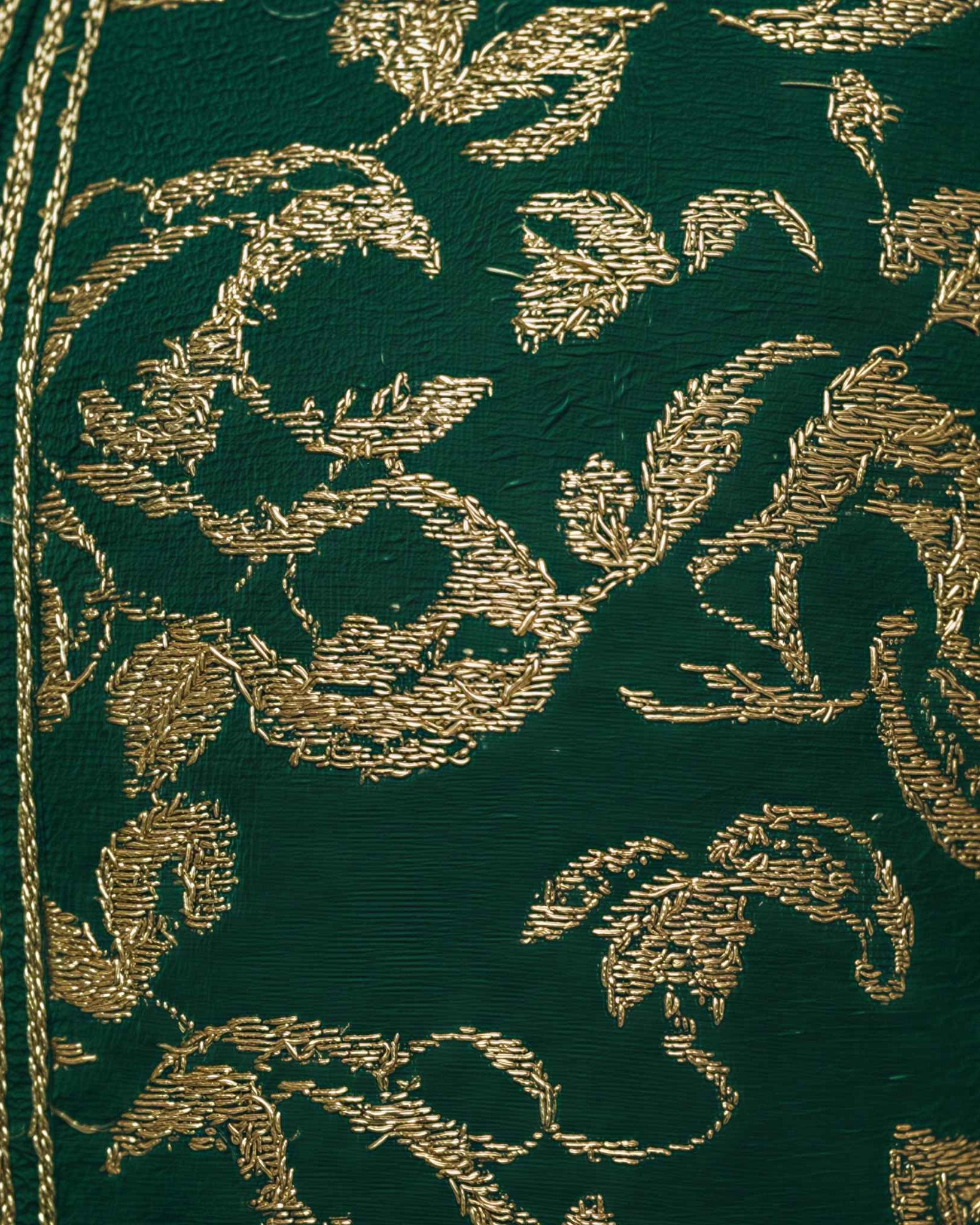 Ivory Dawn kaftan embroidered fabric detail in deep green with gold thread