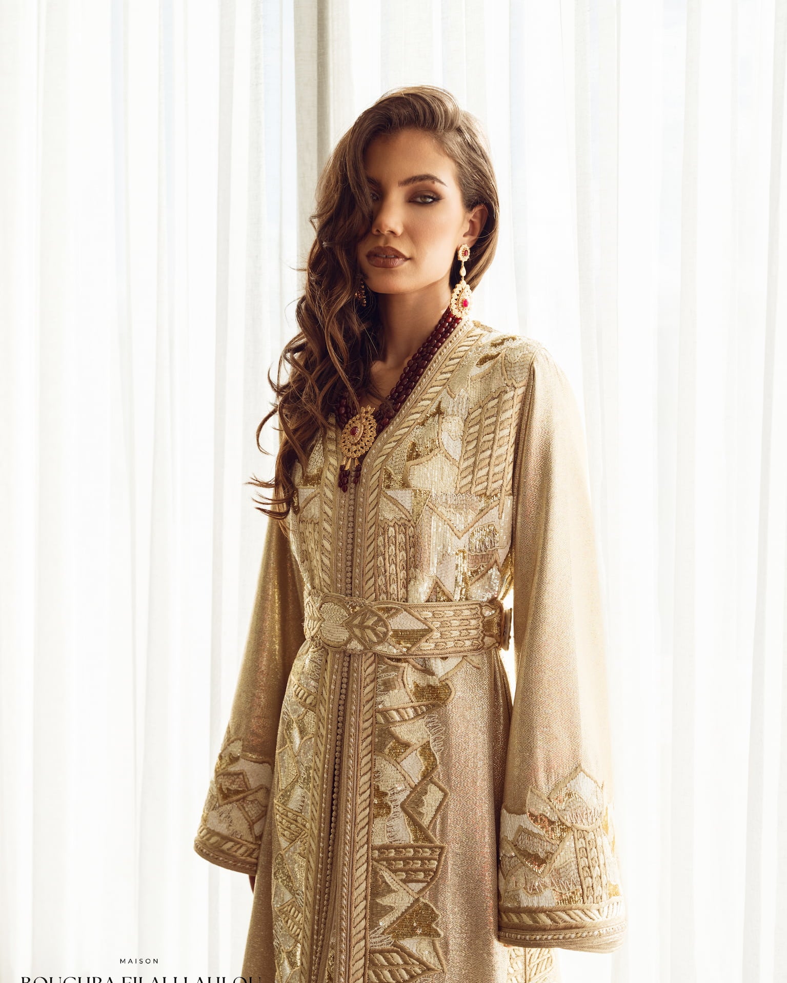 Soft gold couture Moroccan kaftan with delicate embroidery and belt, front view