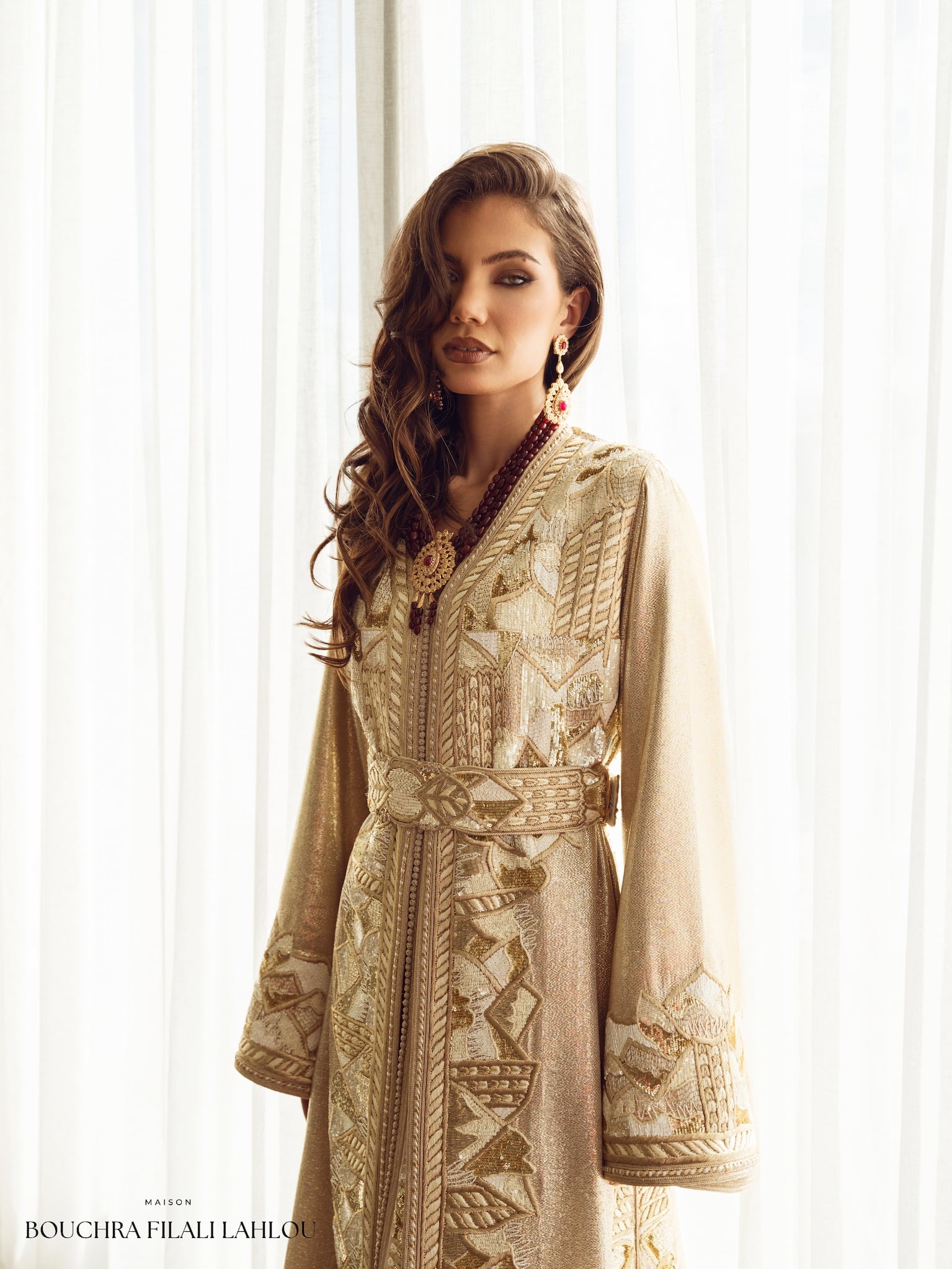 Soft gold couture Moroccan kaftan with delicate embroidery and belt, front view